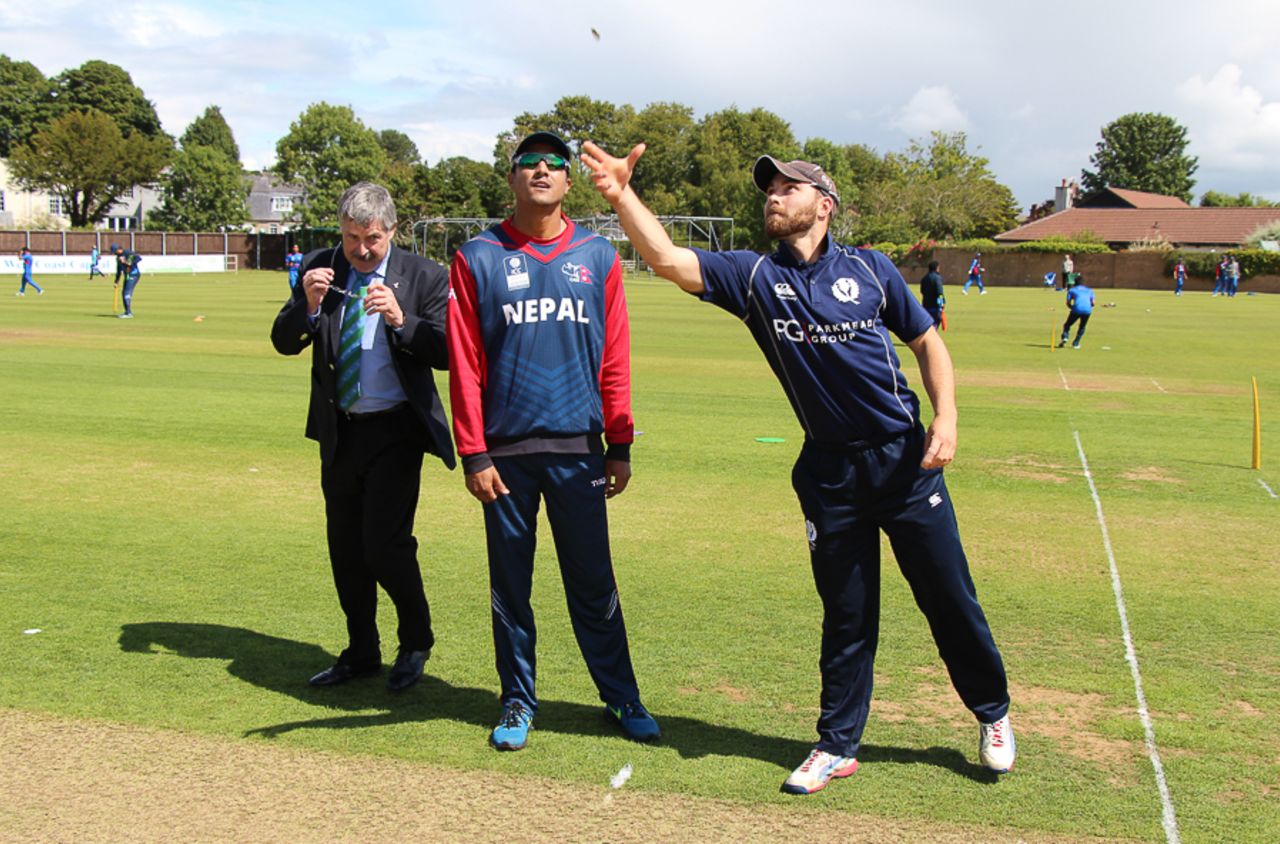 Preston Mommsen spins the coin toss, Scotland v Nepal, ICC World Cricket League Championship, Ayr, July 29, 2015
