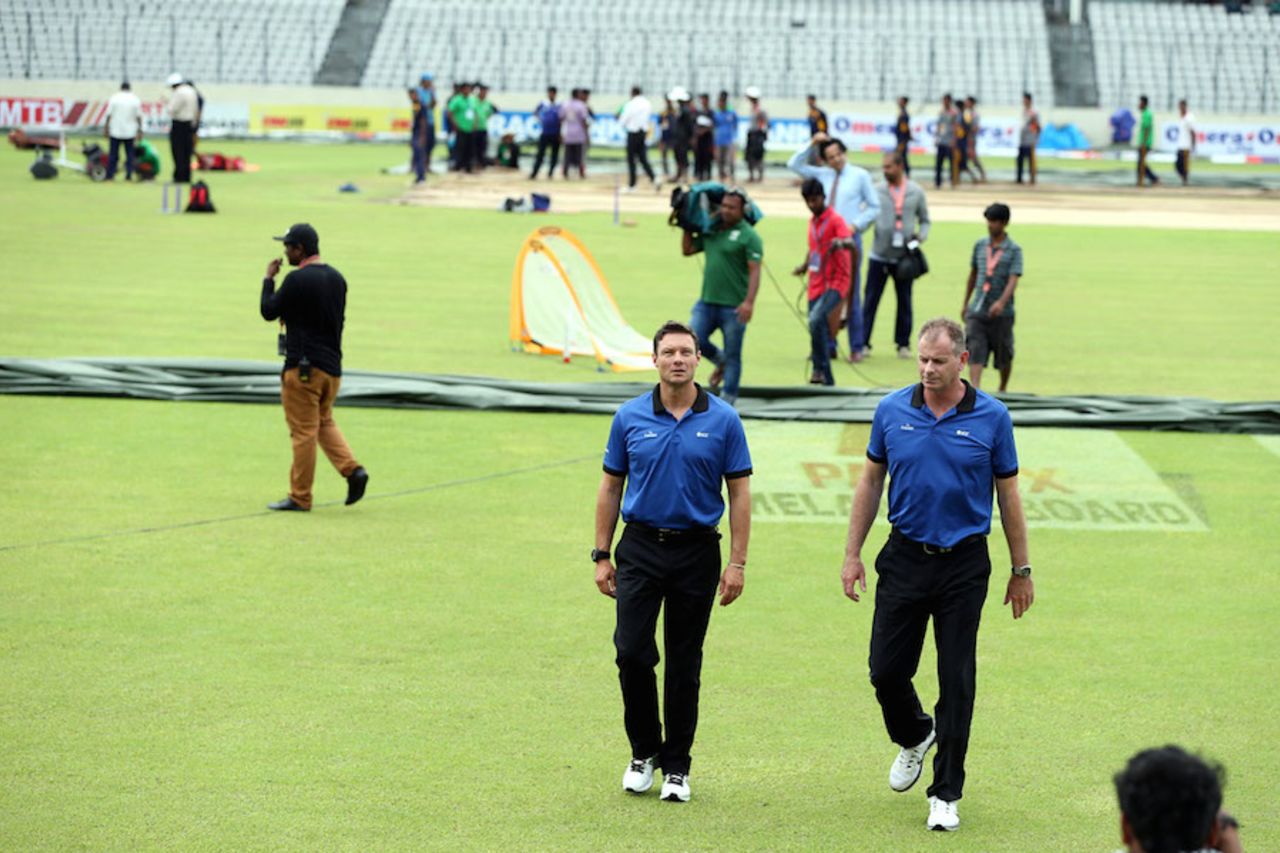 Umpires Richard Kettleborough and Paul Reiffel walk back, Bangladesh v South Africa, 2nd Test, Mirpur, 3rd day, August 1, 2015