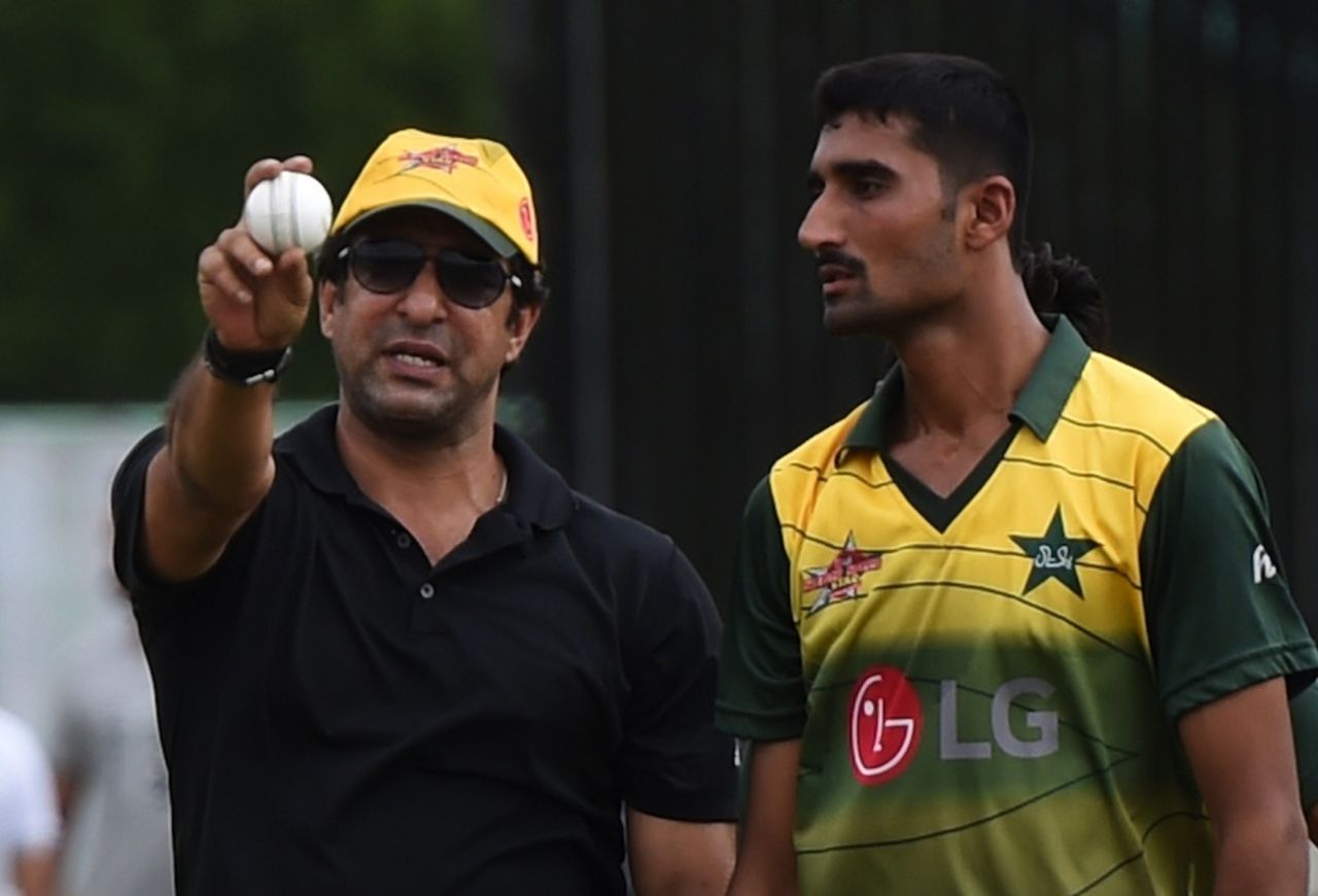 Wasim Akram works with a young Pakistani bowler at a PCB training camp, Karachi, August 1, 2015