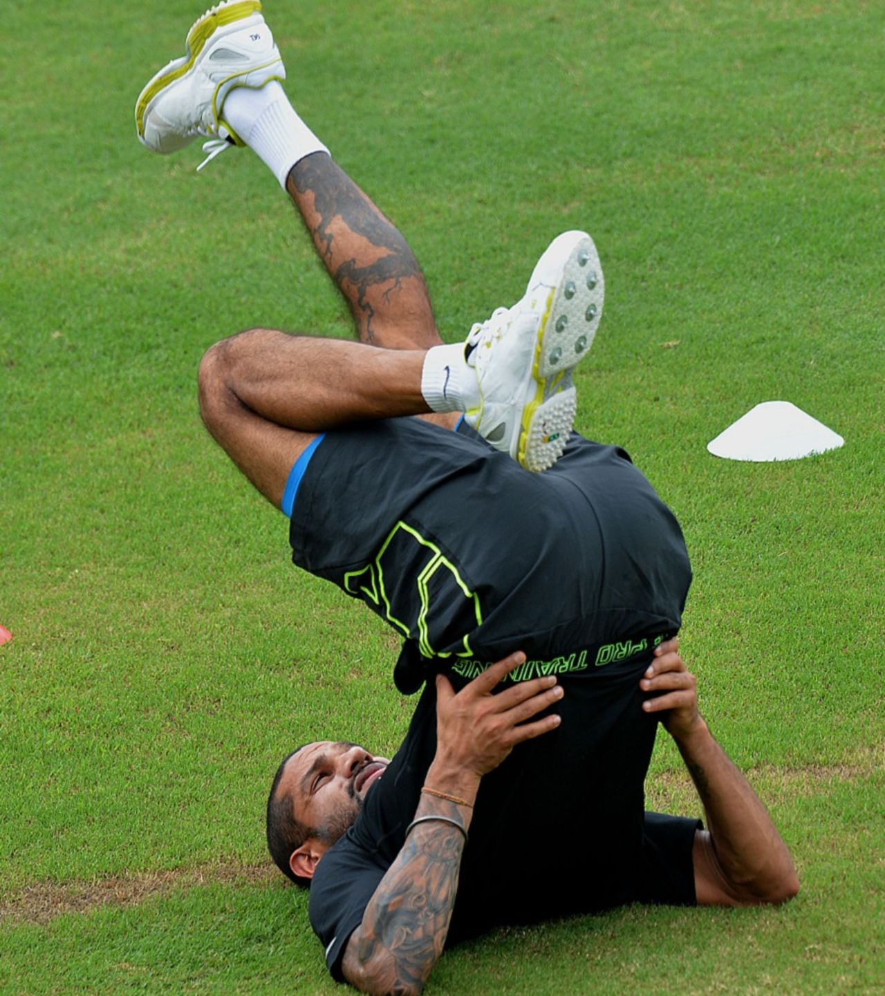 Shikhar Dhawan stretches out during India's training, Colombo, August 5, 2015