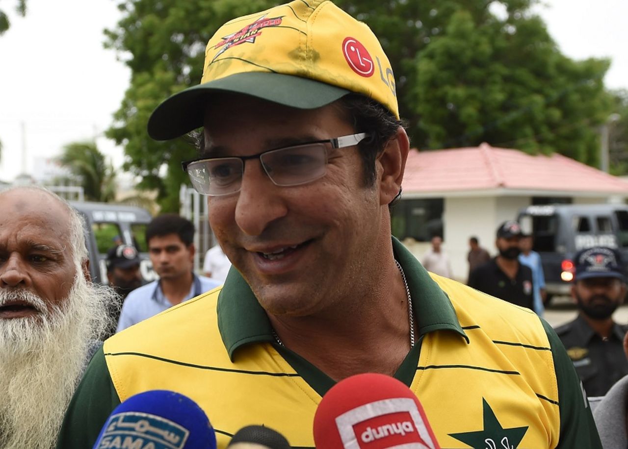 Wasim Akram speaks to the media after a gunman opened fire on his car, Karachi, August 5, 2015