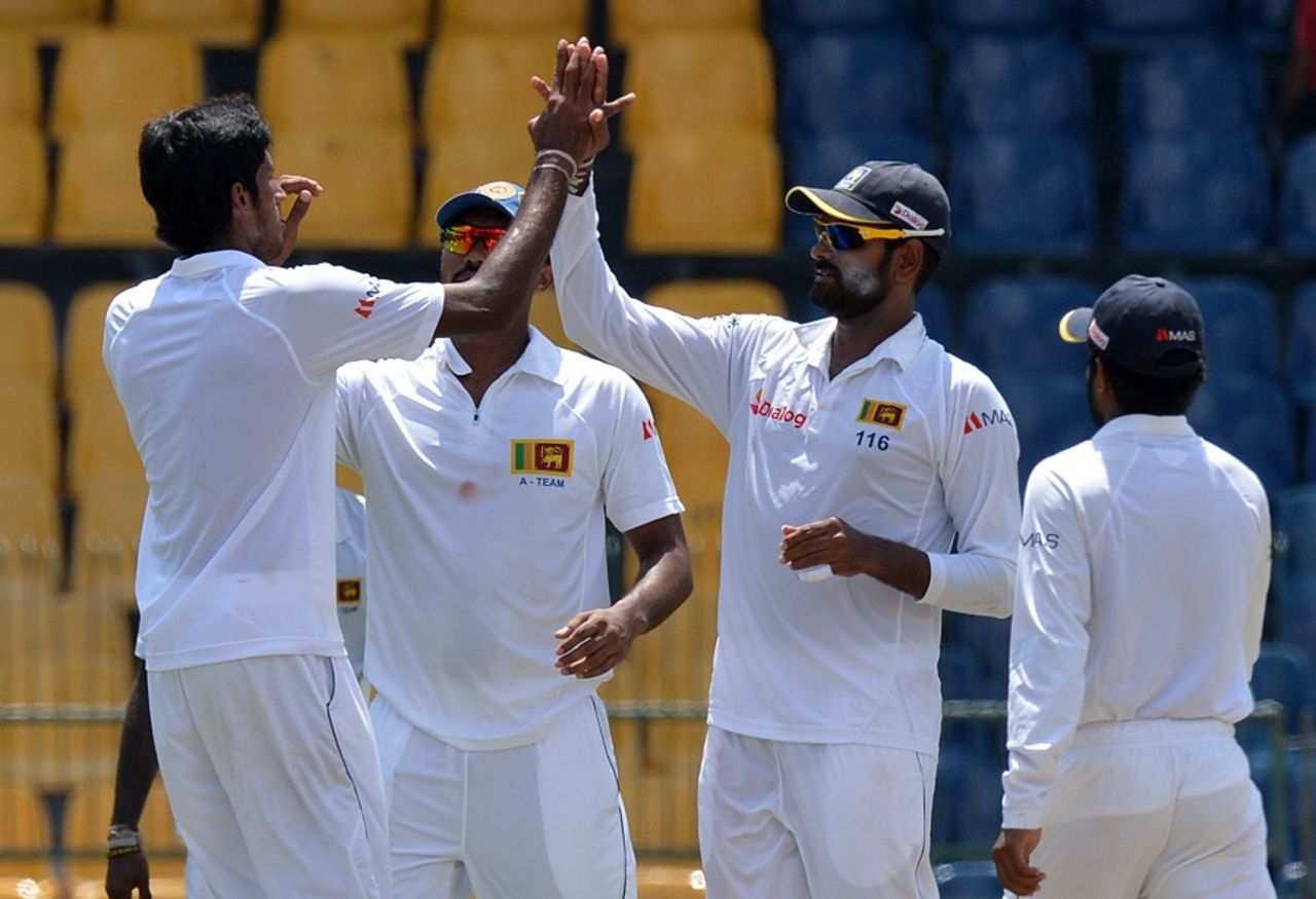 Sri Lanka Board President's XI players celebrate Virat Kohli's dismissal, Sri Lanka Board President's XI v Indians, tour match, Colombo, 1st day, August 6, 2015 