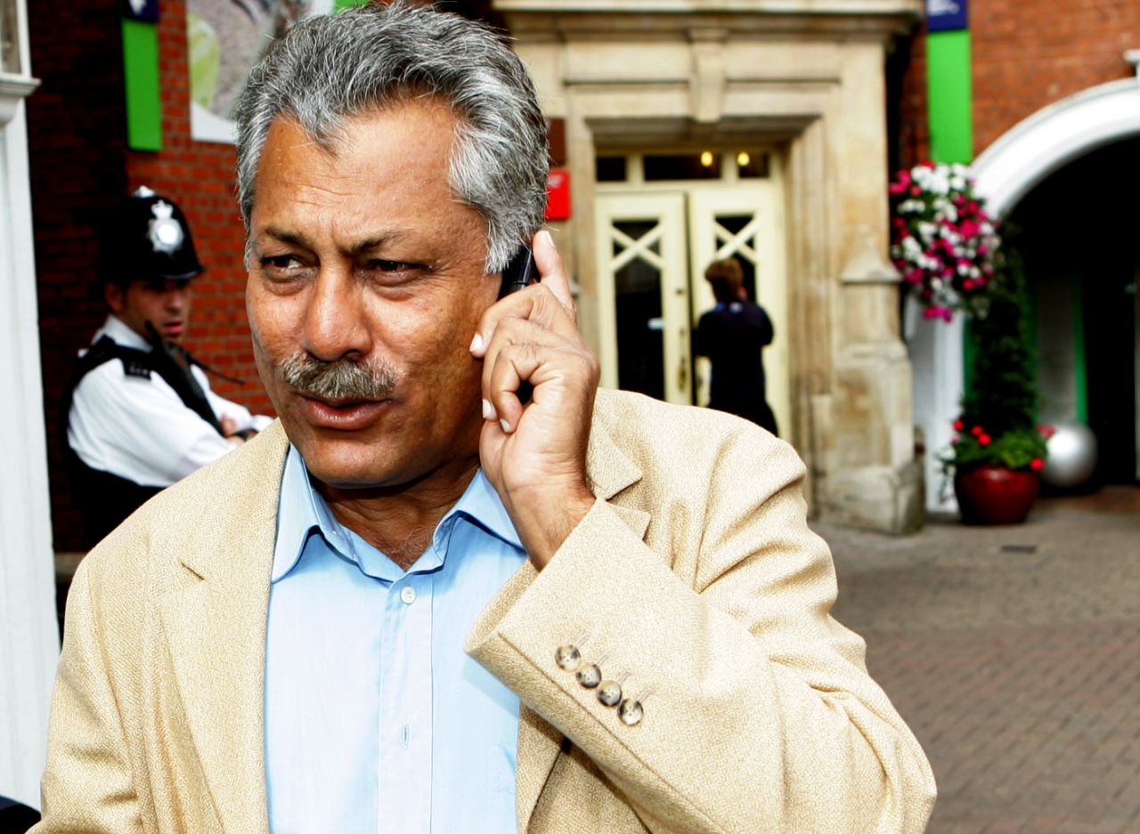 Zaheer Abbas talks on the phone as he walks towards the team bus at The Oval, London, August 21, 2006