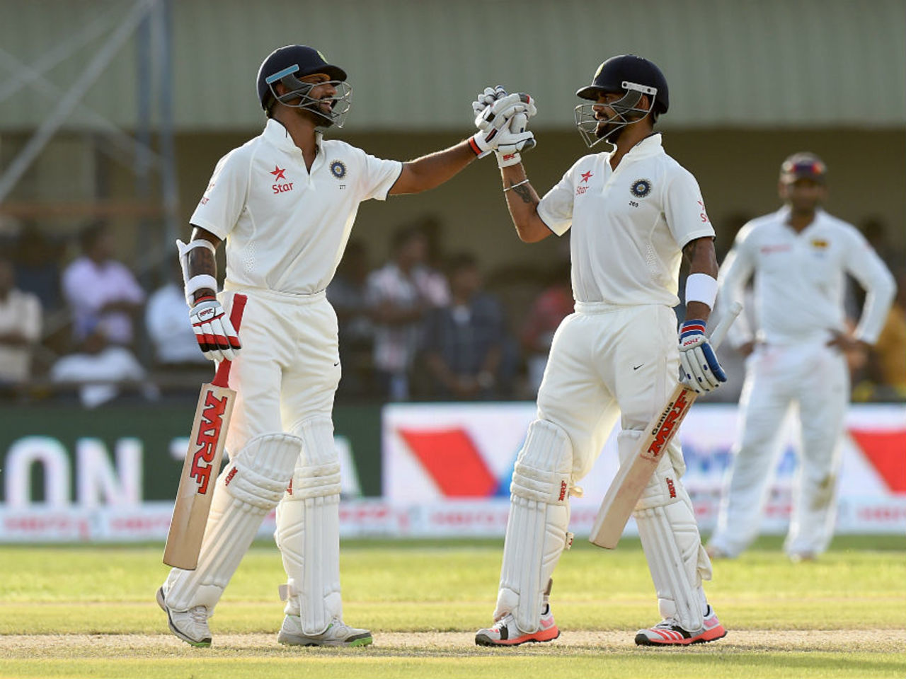 Shikhar Dhawan is congratulated after getting to his fifty, Sri Lanka v India, 1st Test, Galle, 1st day, August 12, 2015