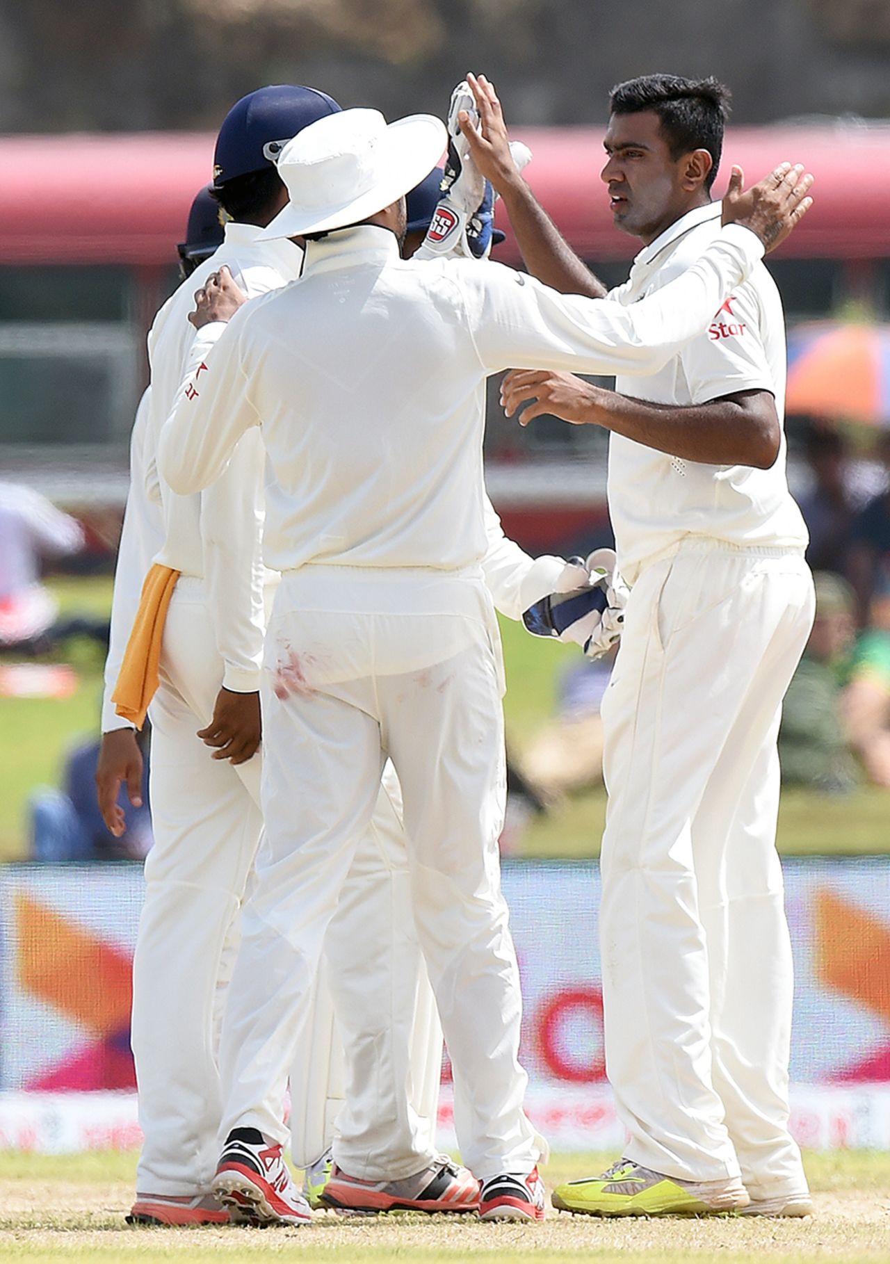 Team-mates congratulate R Ashwin after a Sri Lankan dismissal, Sri Lanka v India, 1st Test, Galle, 1st day, August 12, 2015