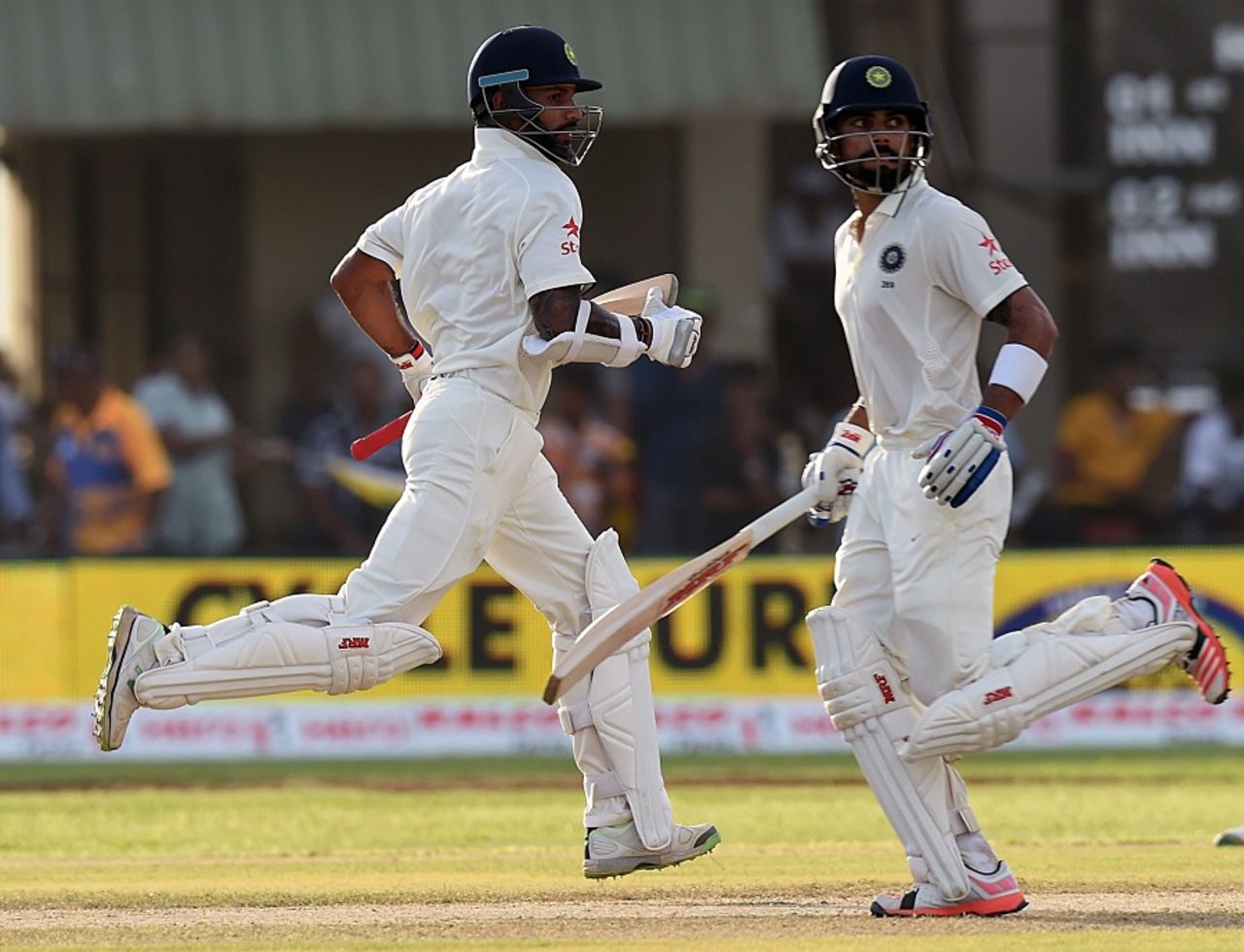 Shikhar Dhawan and Virat Kohli complete a run, Sri Lanka v India, 1st Test, Galle, 1st day, August 12, 2015