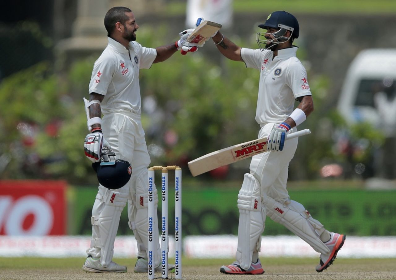Shikhar Dhawan is congratulated by Virat Kohli after he completed his century, Sri Lanka v India, 1st Test, Galle, 2nd day, August 13, 2015