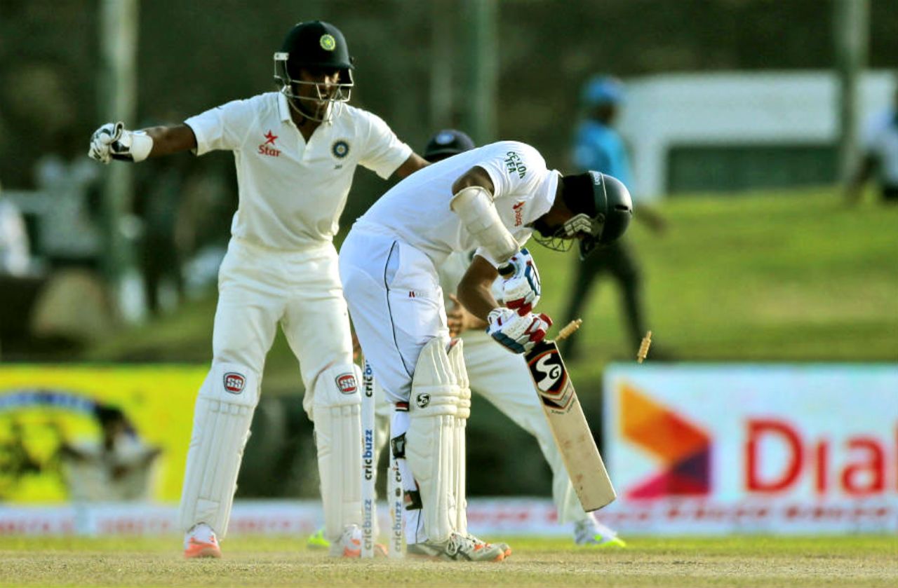 Dimuth Karunaratne's stumps are rattled by an R Ashwin delivery, Sri Lanka v India, 1st Test, Galle, 2nd day, August 13, 2015