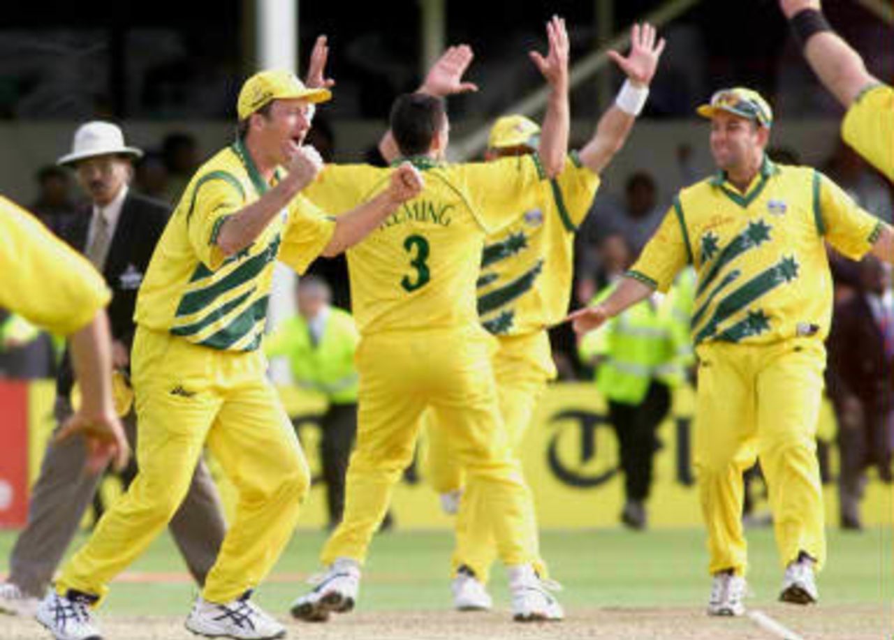 Australian Cricket Captain Steve Waugh (left) celebrates with his side after they gained a dramatic victory over South Africa in the semi-final of the Cricket World Cup at Edgbaston, Birmingham, 17 June 1999.