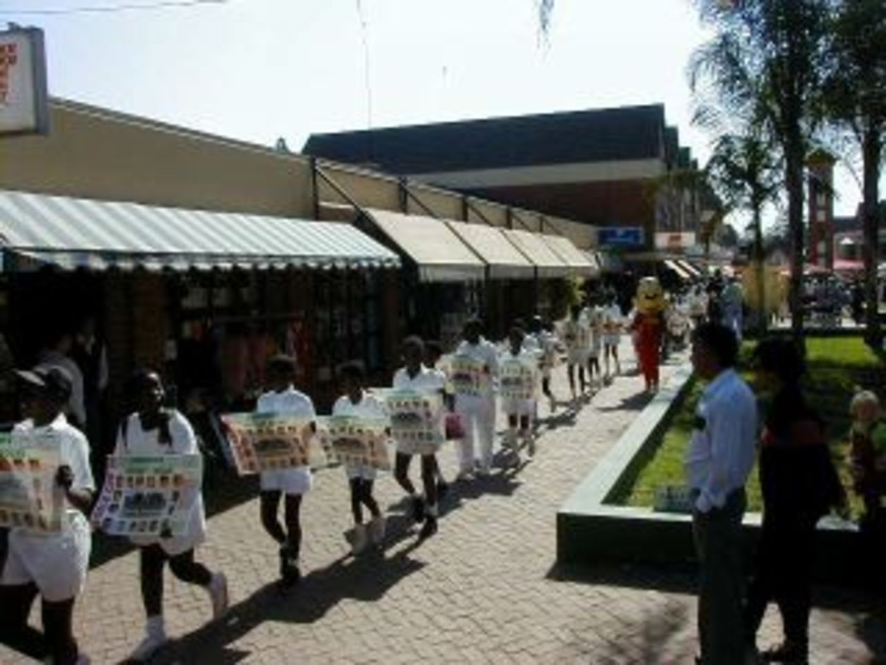 Children with Zimbabwe team posters - The Zimbabwe World Cup team is welcomed home  with a parade in Harare - 19 June 1999