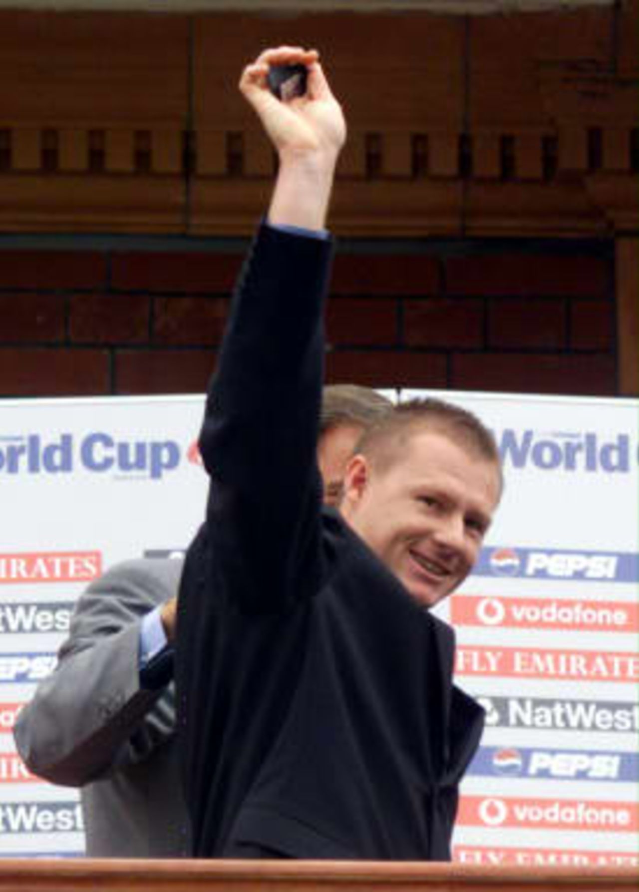 South Africa's Lance Klusener holds up his man of the series medal after the Cricket World Cup final where Australia defeated Pakistan by 8 wickets at Lords in London, 20 June 1999.
