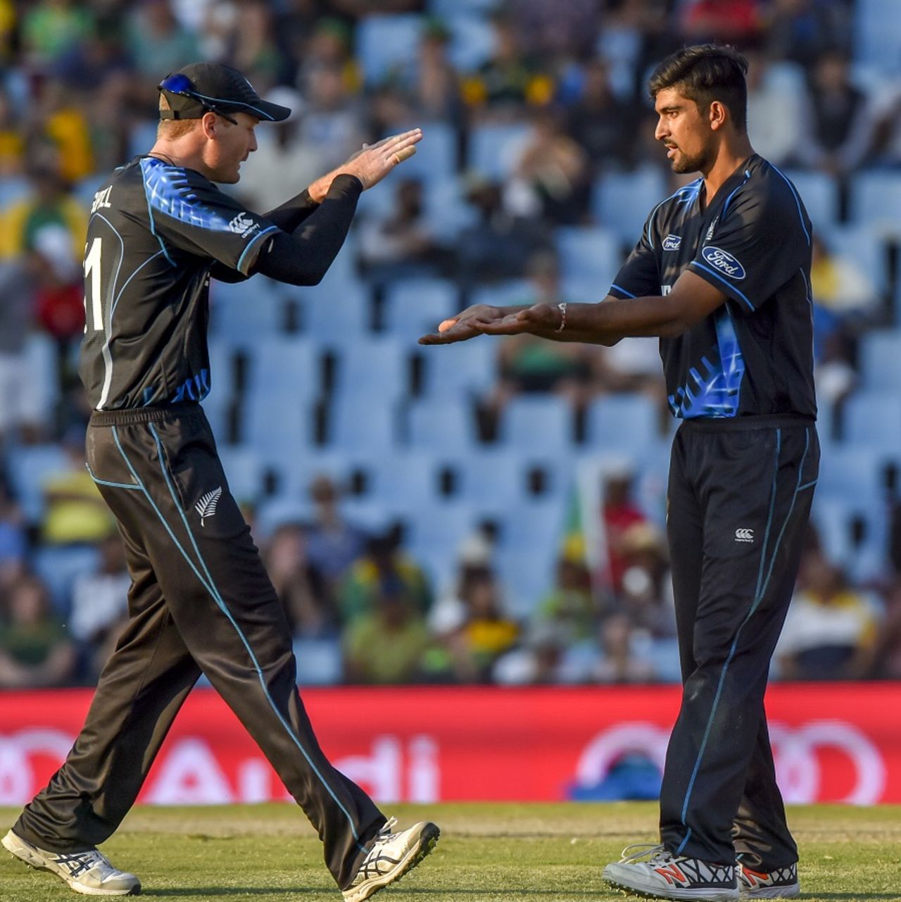 Ish Sodhi is congratulated by Martin Guptill after he dismissed David Wiese, South Africa v New Zealand, 2nd T20I, Centurion, August 16, 2015 