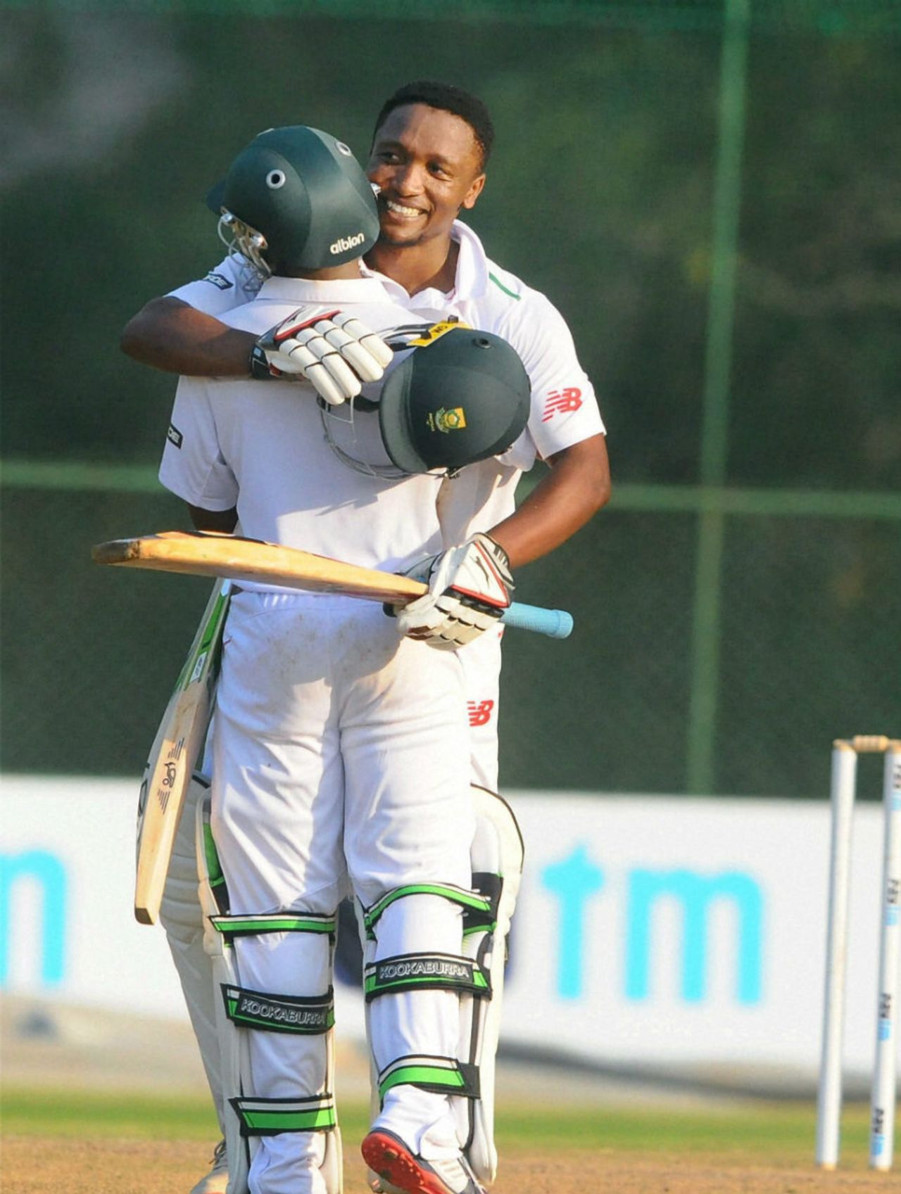 Omphile Ramela gets a hug from Temba Bavuma after completing his ton, India A v South Africa A, 1st Unofficial Test, Wayanad, August 18, 2015