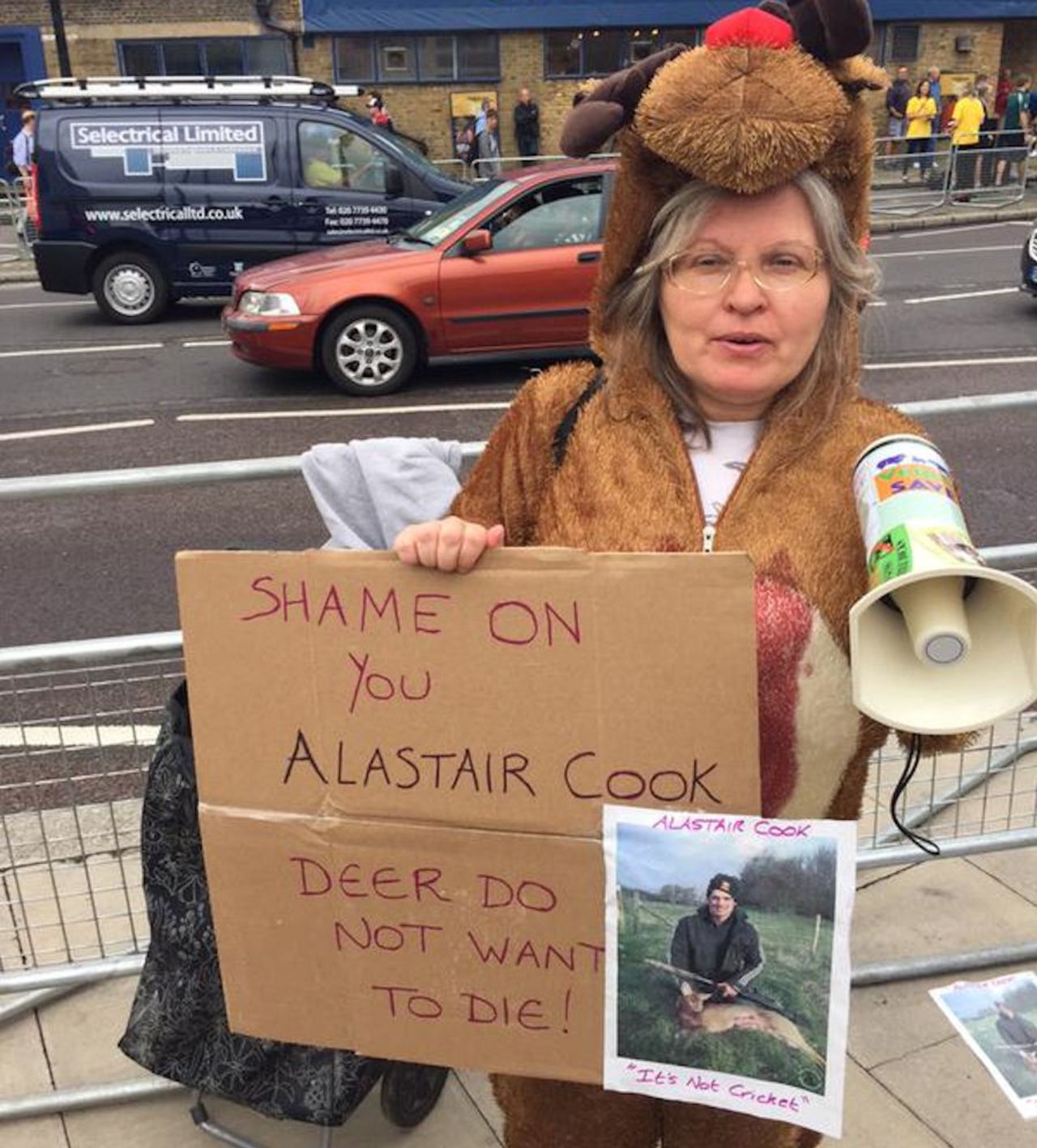 A lone protestor opposes Alastair Cook's fondness for country sports outside the Kia Oval before the final Ashes Test