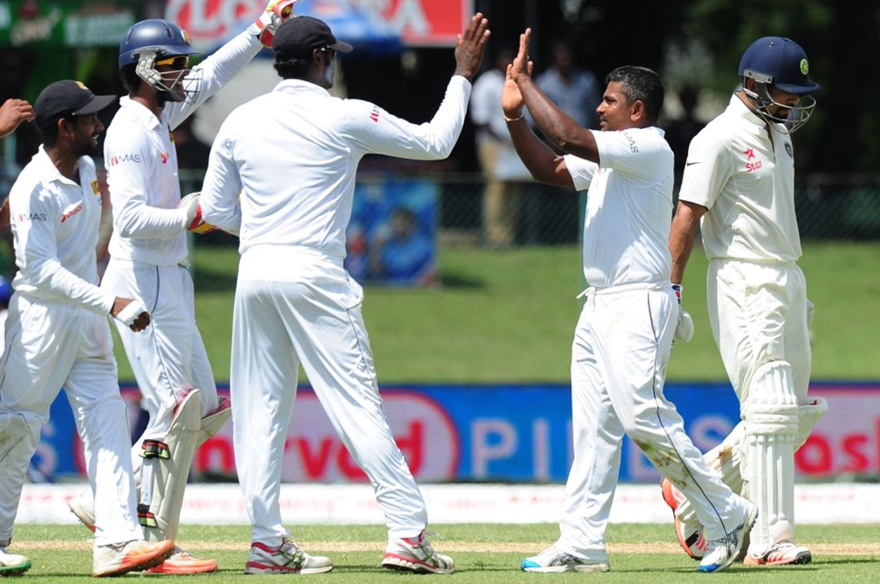 Rangana Herath is congratulated by his team-mates after he dismissed Virat Kohli, Sri Lanka v India, 2nd Test, P Sara Oval, Colombo, 1st day, August 20, 2015