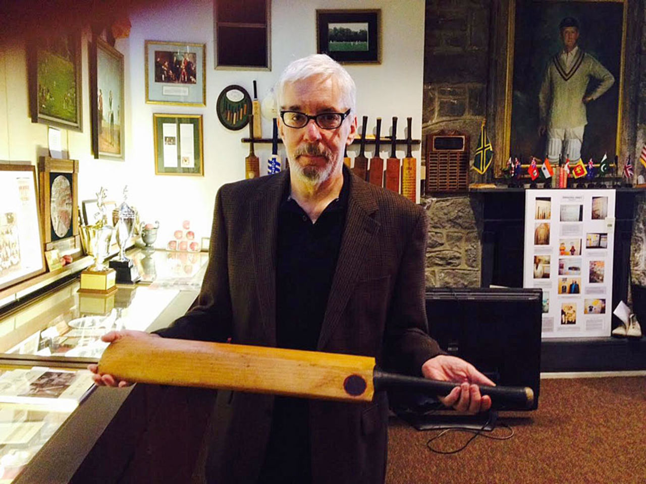 Dave Roberts poses with an bat of Don Bradman's, Haverford, Pennsylvania, 2015