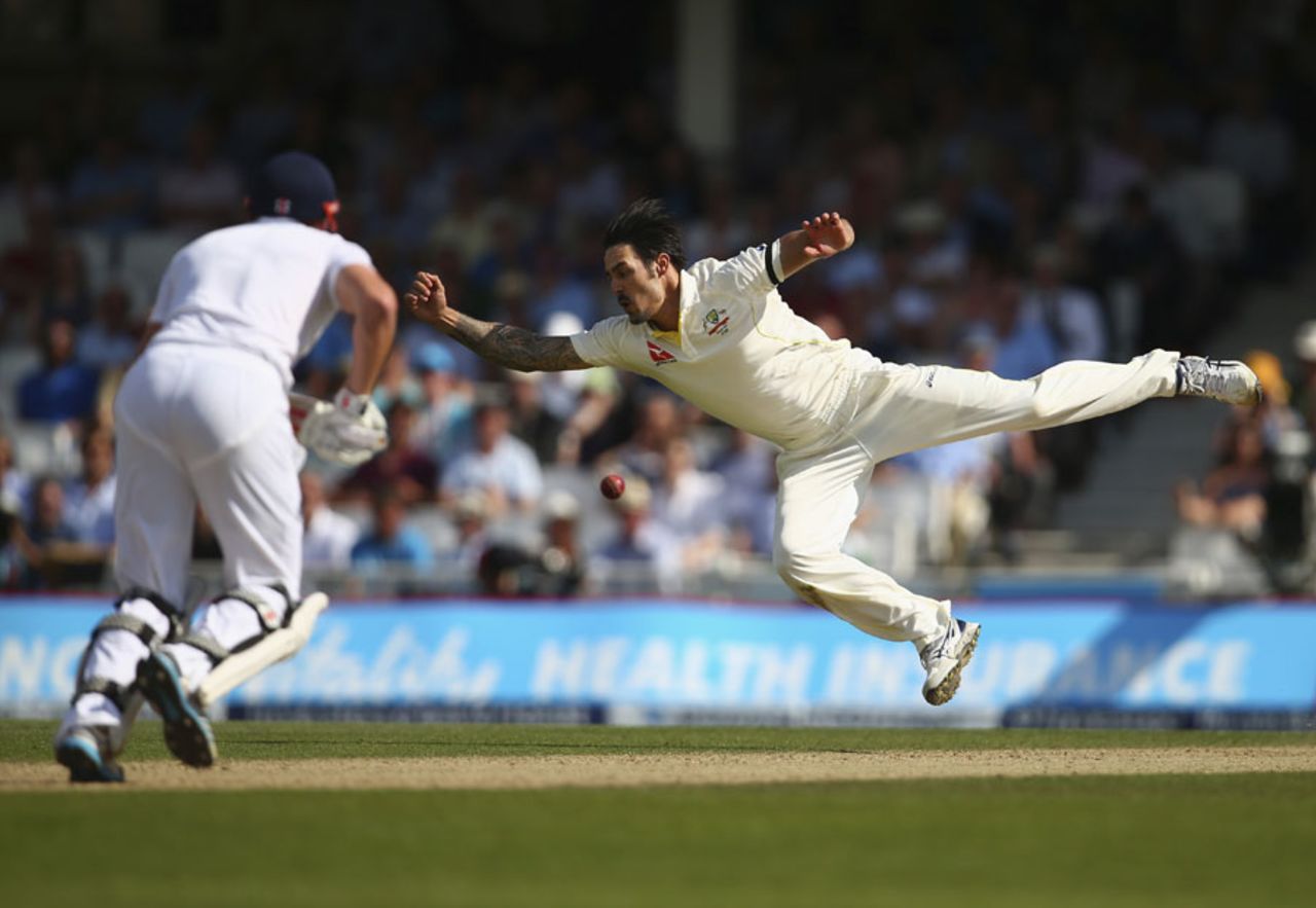 Mitchell Johnson dives in an attempt to catch an uppish on-drive from Jonny Bairstow, England v Australia, 5th Investec Ashes Test, The Oval, 3rd day, August 22, 2015