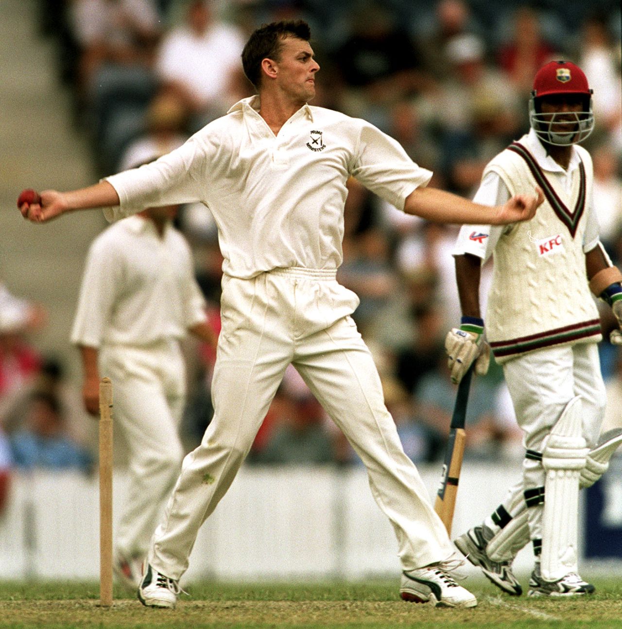 Adam Gilchrist bowls, Prime Minister's XI v West Indies, Canberra, December 7, 2000