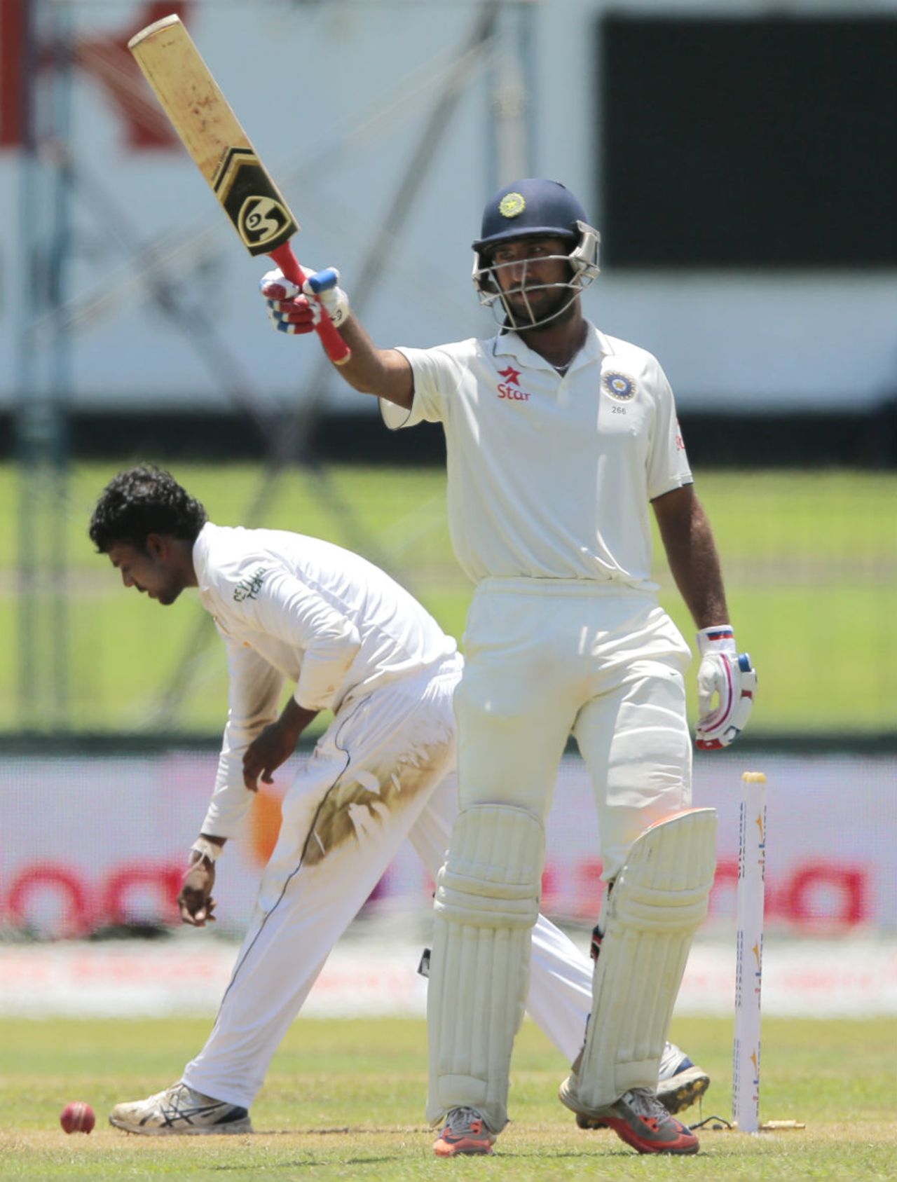 Cheteshwar Pujara raises his bat after making fifty, Sri Lanka v India, 3rd Test, SSC, Colombo, 2nd day, August 29, 2015
