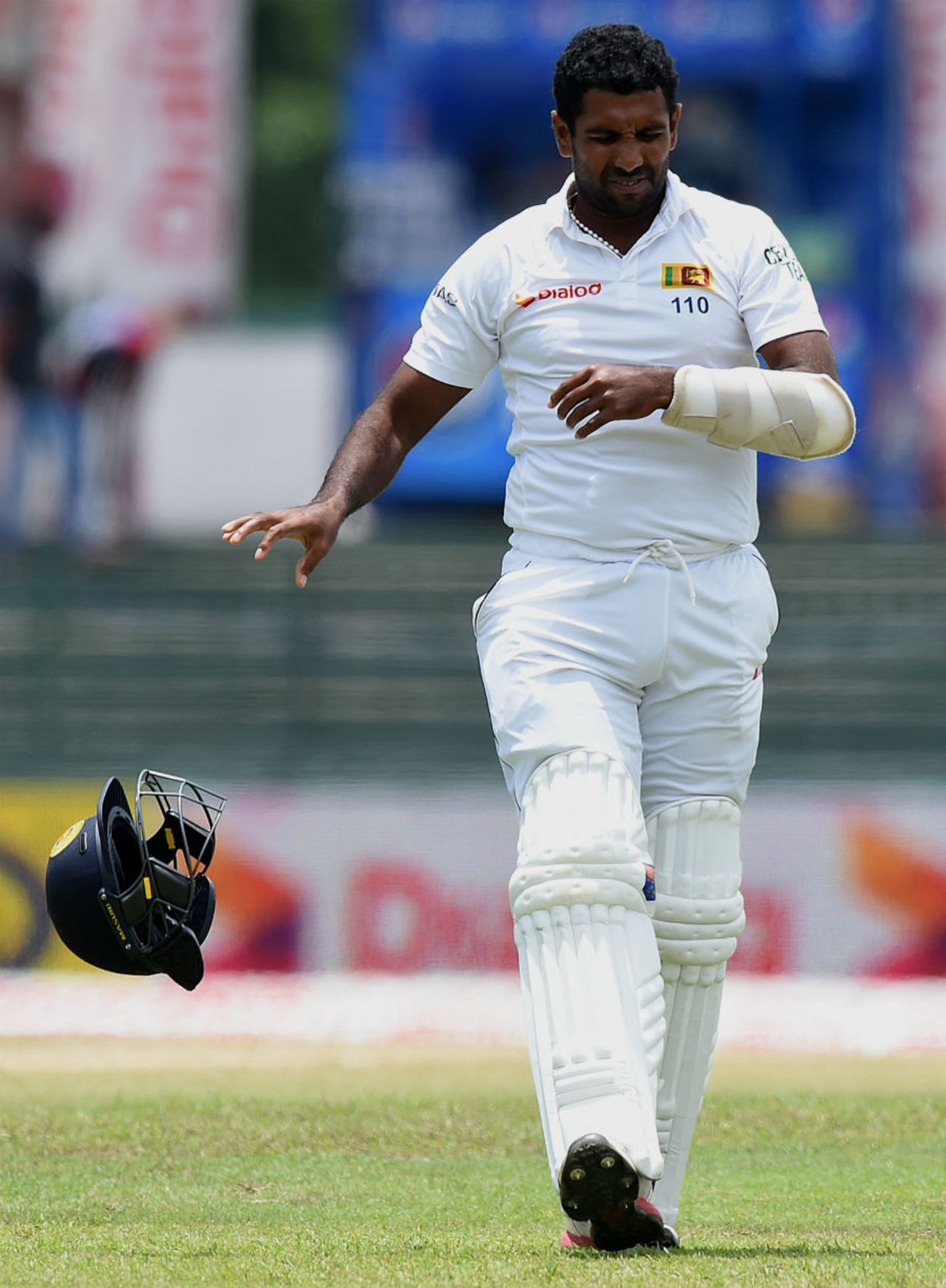 Dhammika Prasad winces after being struck on his arm, Sri Lanka v India, 3rd Test, SSC, Colombo, 3rd day, August 30, 2015