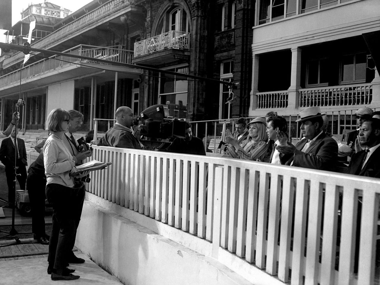 Julie Christie and Dirk Bogarde are filmed at Lord's for their movie <i>Darling</i>, September 29, 1964