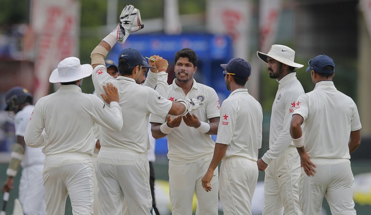 Umesh Yadav is congratulated by his teammates for dismissing Kaushal Silva, Sri Lanka v India, 3rd Test, SSC, Colombo, 5th day, September 1, 2015