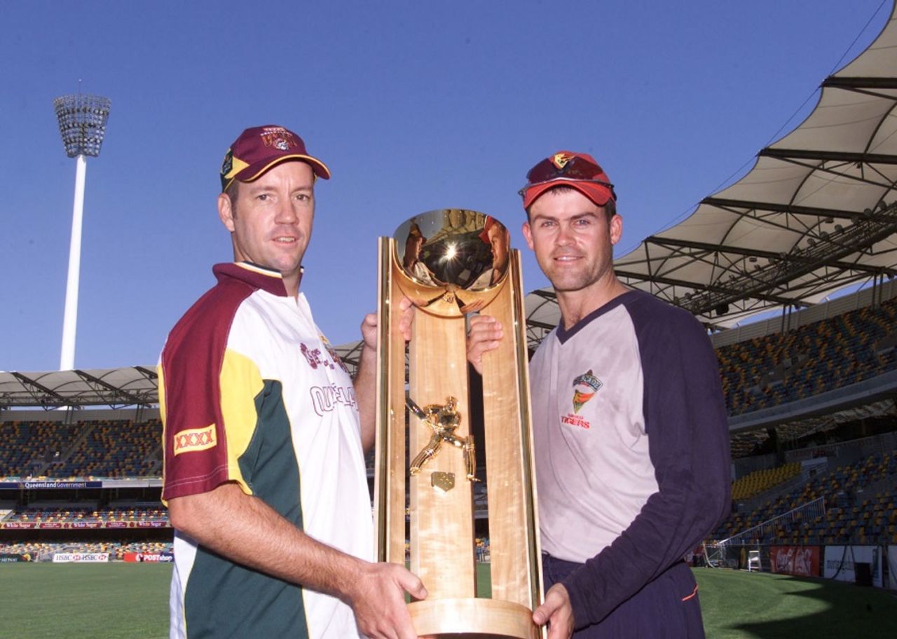 Martin Love and Jamie Cox pose with the Pura Cup Trophy, Queensland v Victoria, Pura Cup final, Brisbane, March 21, 2002