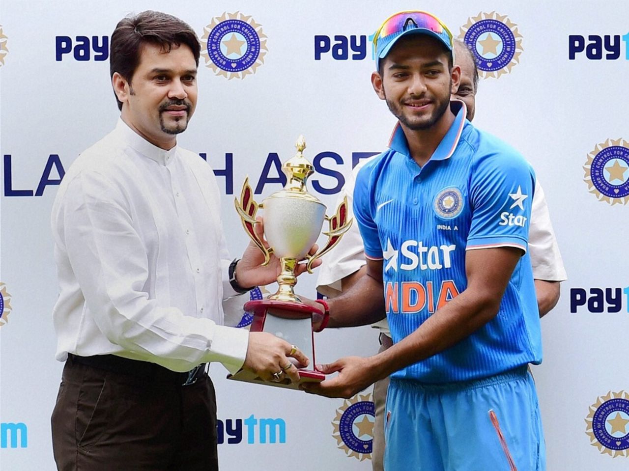 BCCI secretary Anurag Thakur hands Unmukt Chand the series trophy, India A v Bangladesh A, 3rd unofficial ODI, Bangalore, September 20, 2015