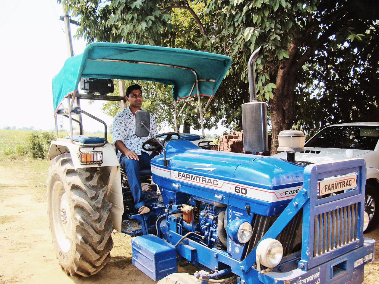 Praveen Kumar drives a tractor, Barnawa, June 2015