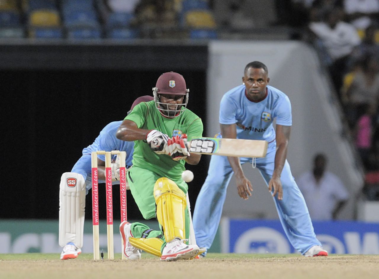 Brian Lara sweeps during his 63 off 53 balls in a match to raise money for Dominica, UWI Vice Chancellor's XI and WICB President's XI, Barbados, September 26, 2015