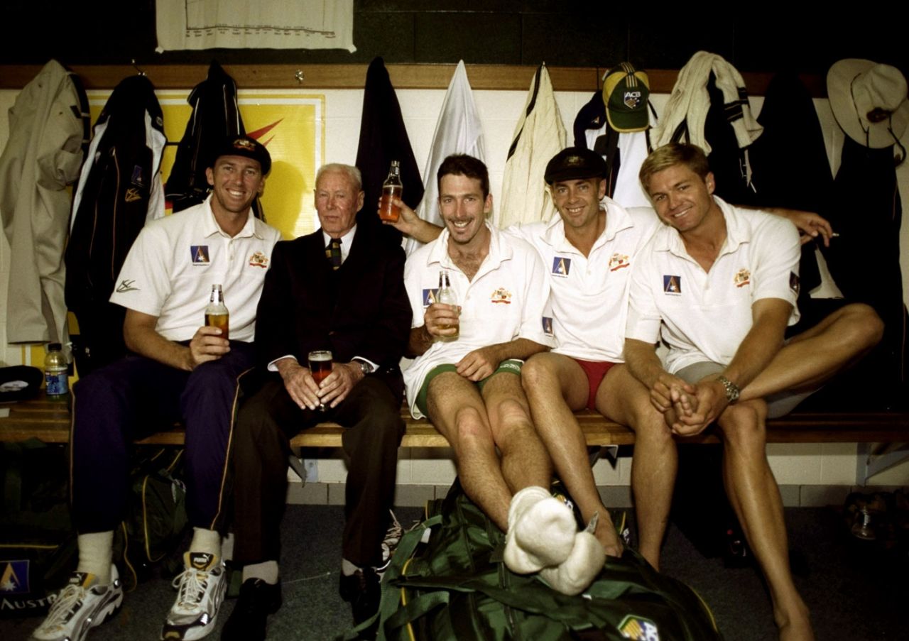 Invincible Bill Brown shares a beer with Australian players in the dressing room in Hobart, Australia v Pakistan, 2nd Test, Hobart, 4th day, November 21, 1999