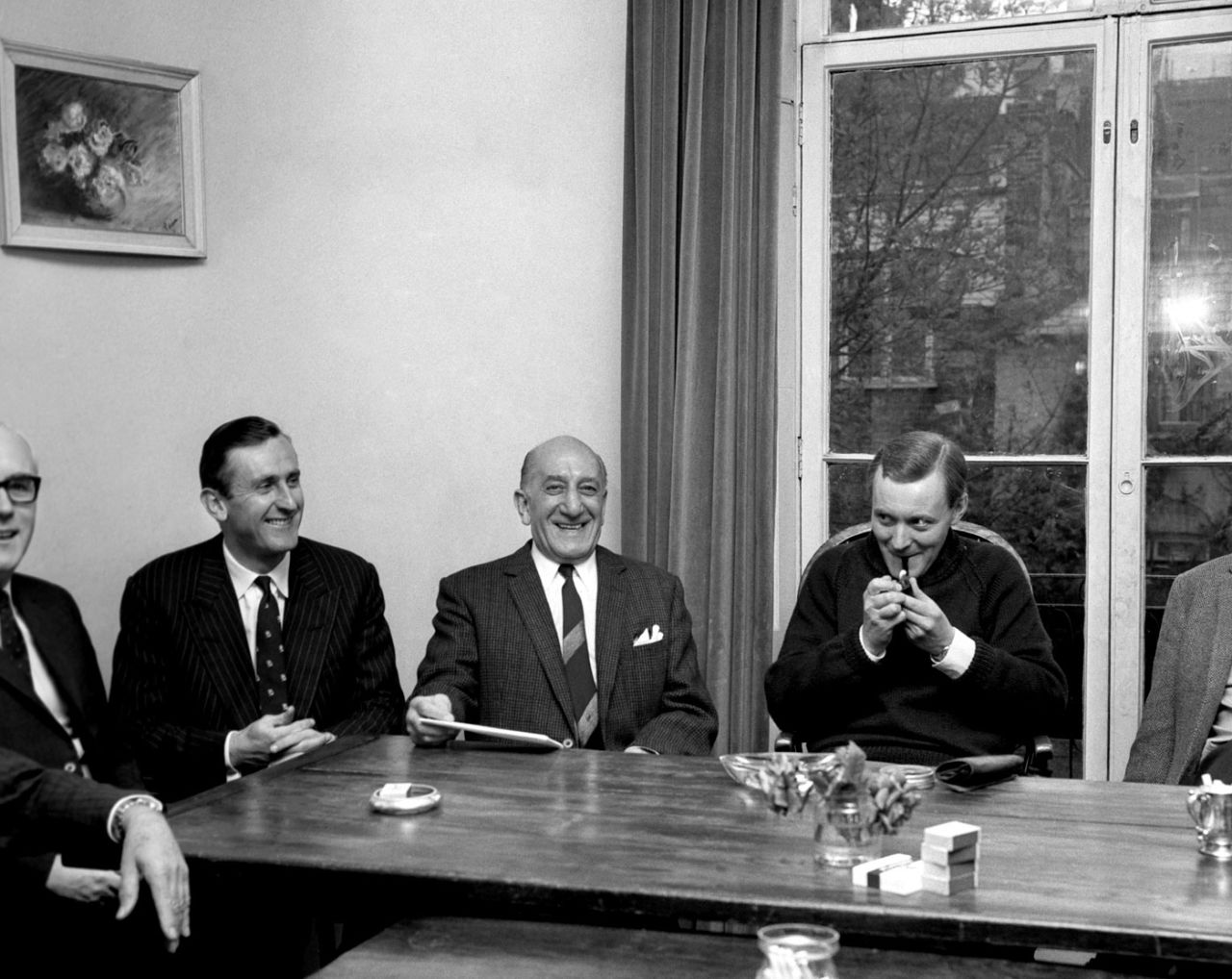 Ted Dexter (second from left) sits with fight promoter Harry Levine and Postmaster General Anthony Wedgwood Benn (smoking a pipe) to discuss the televising of the Muhammad Ali-Henry Cooper fight at Highbury, London, May 8, 1966