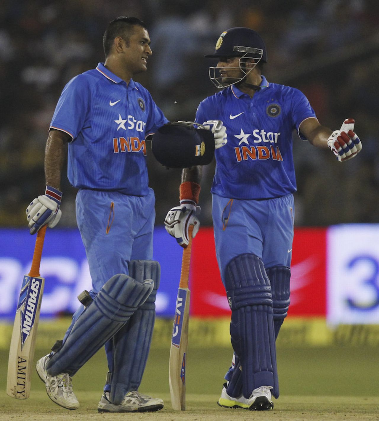 MS Dhoni and Suresh Raina chat during their fifth-wicket stand, India v South Africa, 2nd T20I, Cuttack, October 5, 2015