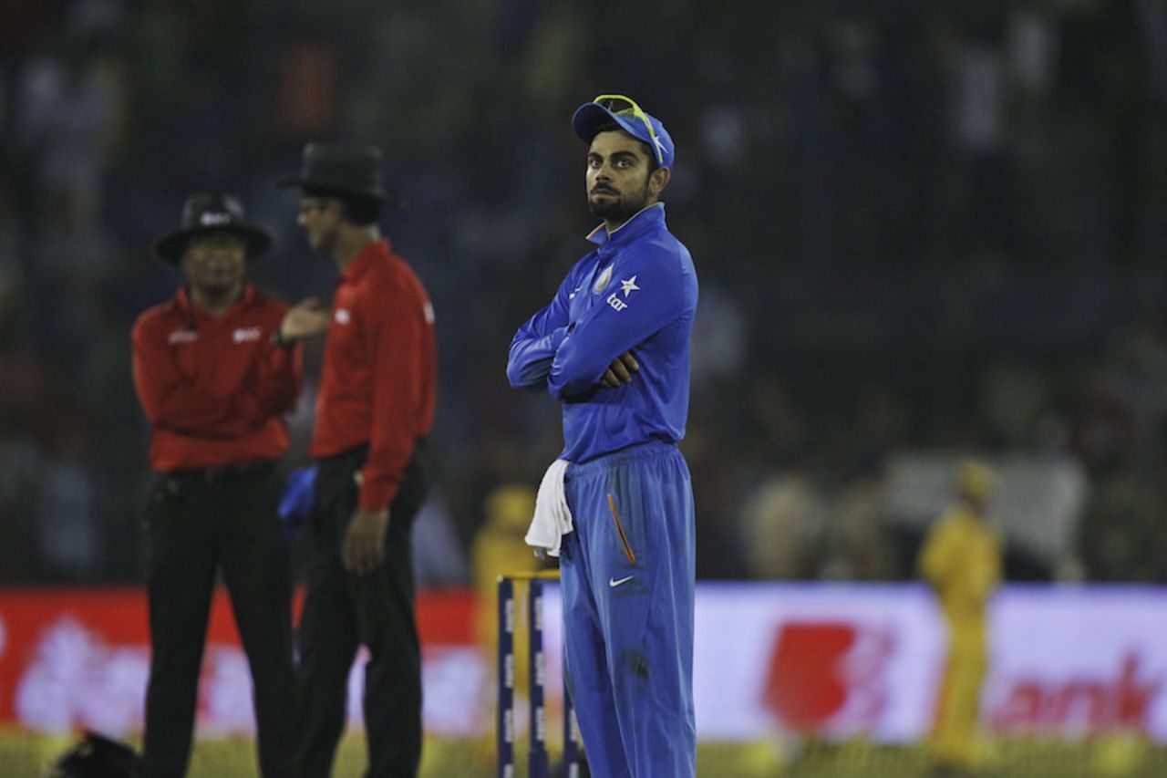 Virat Kohli waits during a crowd interruption, India v South Africa, 2nd T20I, Cuttack, October 5, 2015