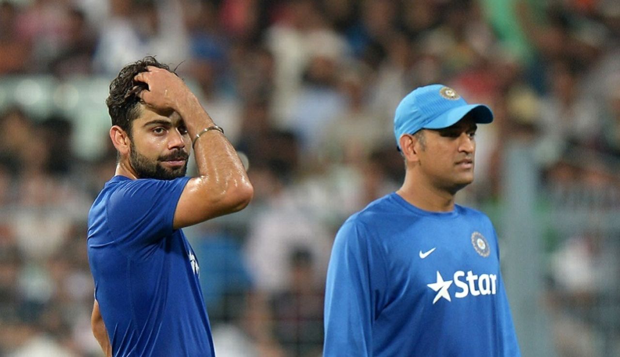 Virat Kohli and MS Dhoni wait for play to start, India v South Africa, 3rd T20I, Kolkata, October 8, 2015