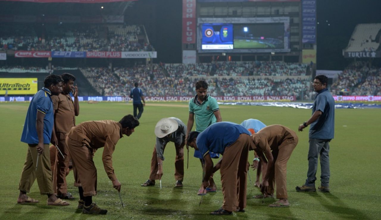 Ground staff work on the outfield at the Eden Gardens, India v South Africa, 3rd T20I, Kolkata, October 8, 2015