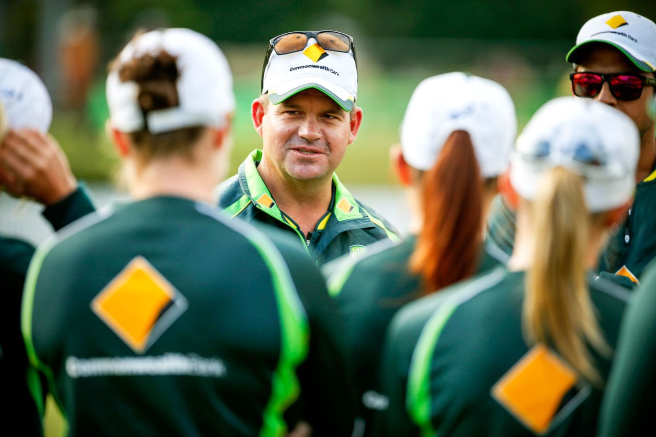 Coach Matthew Mott talks to players during the match between the National Indigenous Development Squad and the Southern Stars at Allan Border Field, Brisbane, July 4, 2015
