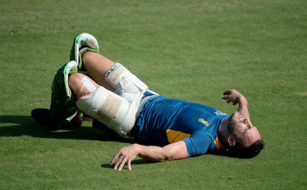 Faf du Plessis winces as he falls to the ground during a training session, Indore, October 13, 2015