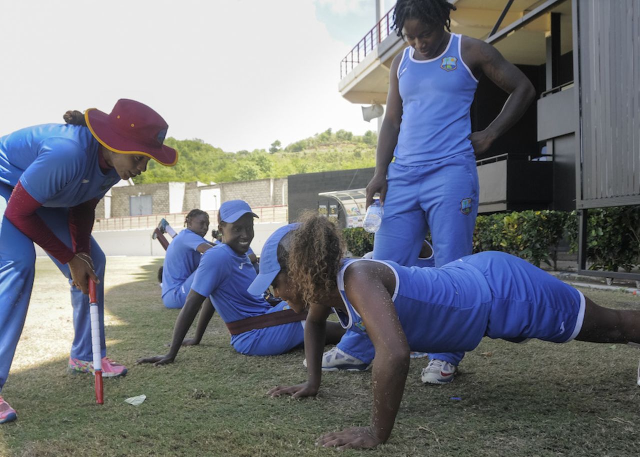 Hayley Matthews does push ups in the presence of Deandra Dottin and Merissa Aguilleira, St Lucia, October 14, 2015