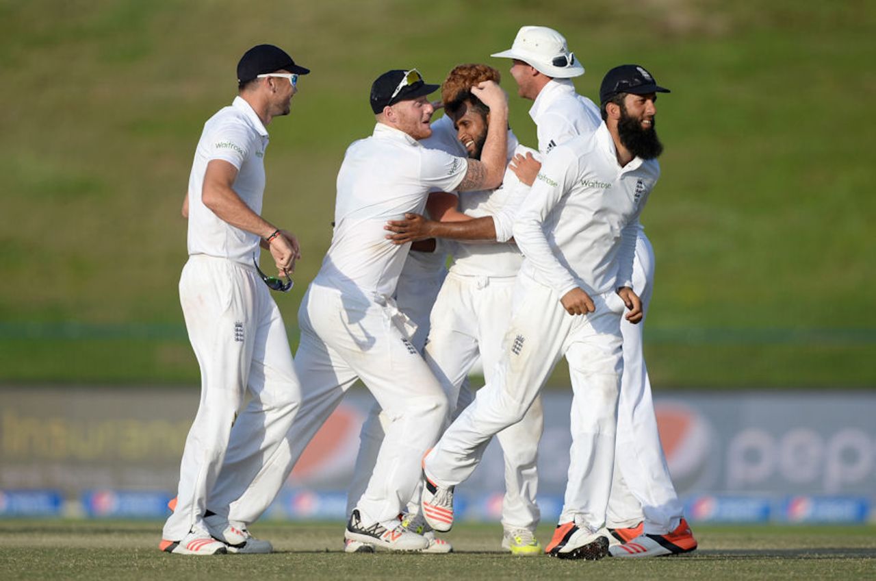 Adil Rashid is congratulated after dismissing Imran Khan to complete a five-wicket haul on debut, Pakistan v England, 1st Test, Abu Dhabi, 5th day, October 1, 2015