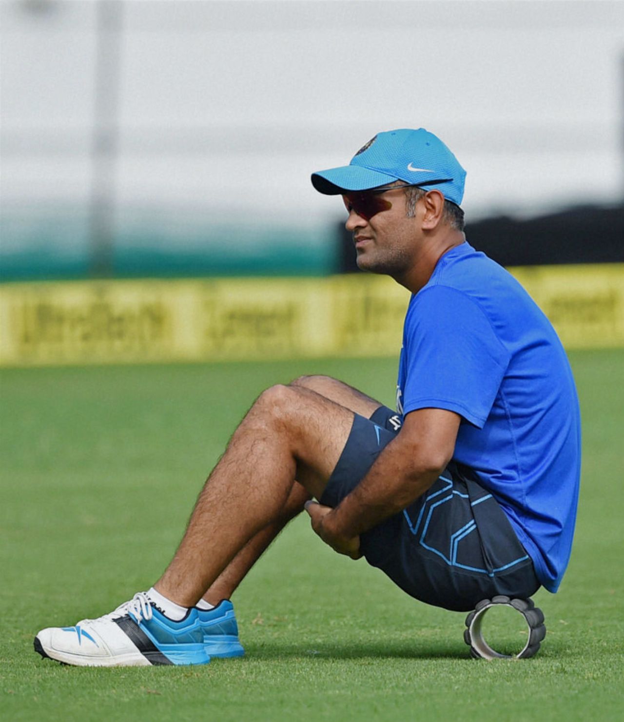 MS Dhoni takes a break during a training session, Rajkot, October 17, 2015
