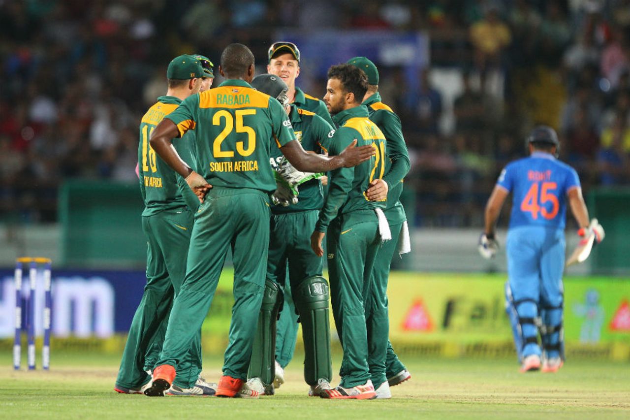 JP Duminy is mobbed by his team-mates after dismissing Rohit Sharma, India v South Africa, 3rd ODI, Rajkot, October 18, 2015