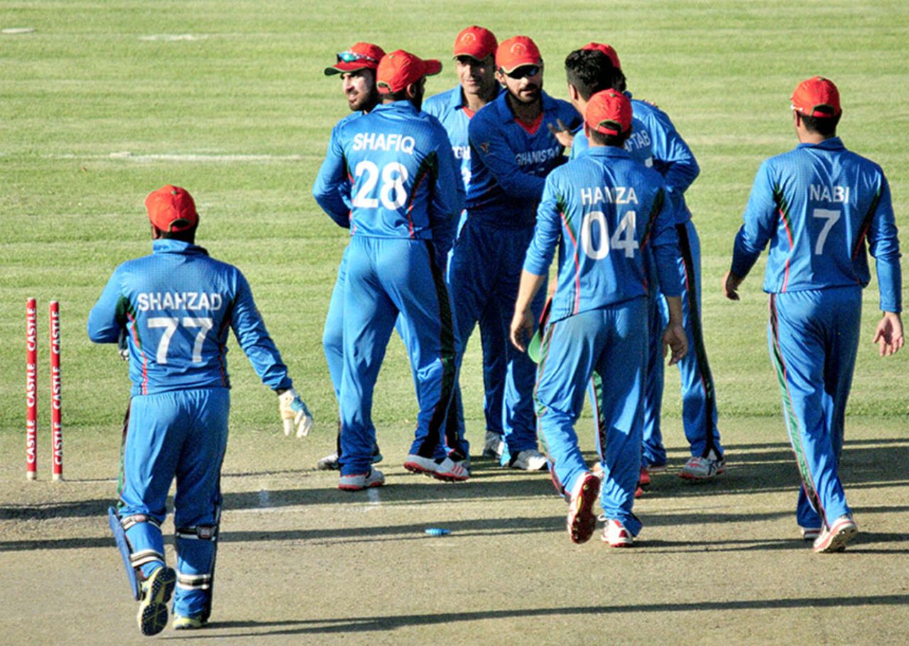 Afghanistan get together after sealing victory, Zimbabwe v Afghanistan, 2nd ODI, Bulawayo, October 18, 2015