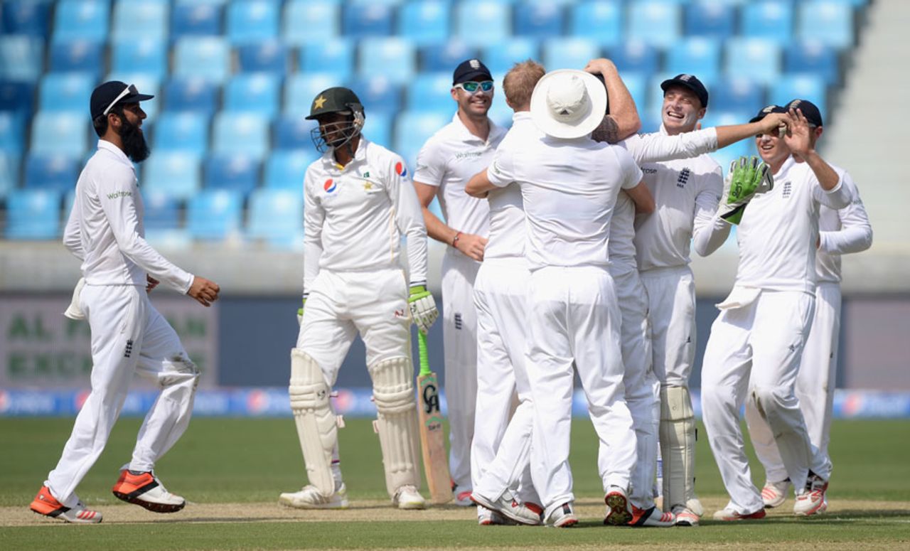 Jonny Bairstow is mobbed after a stunning catch to remove Shoaib Malik, Pakistan v England, 2nd Test, Dubai, 1st day, October 22, 2015