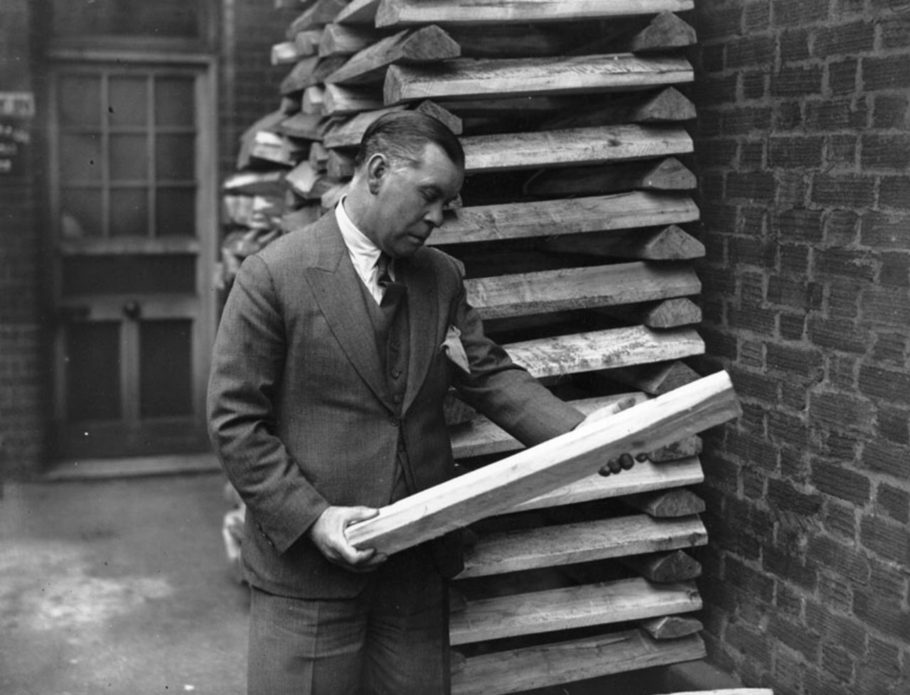Patsy Hendren the rough cast willow at a cricket bat factory in St John's Wood, London,