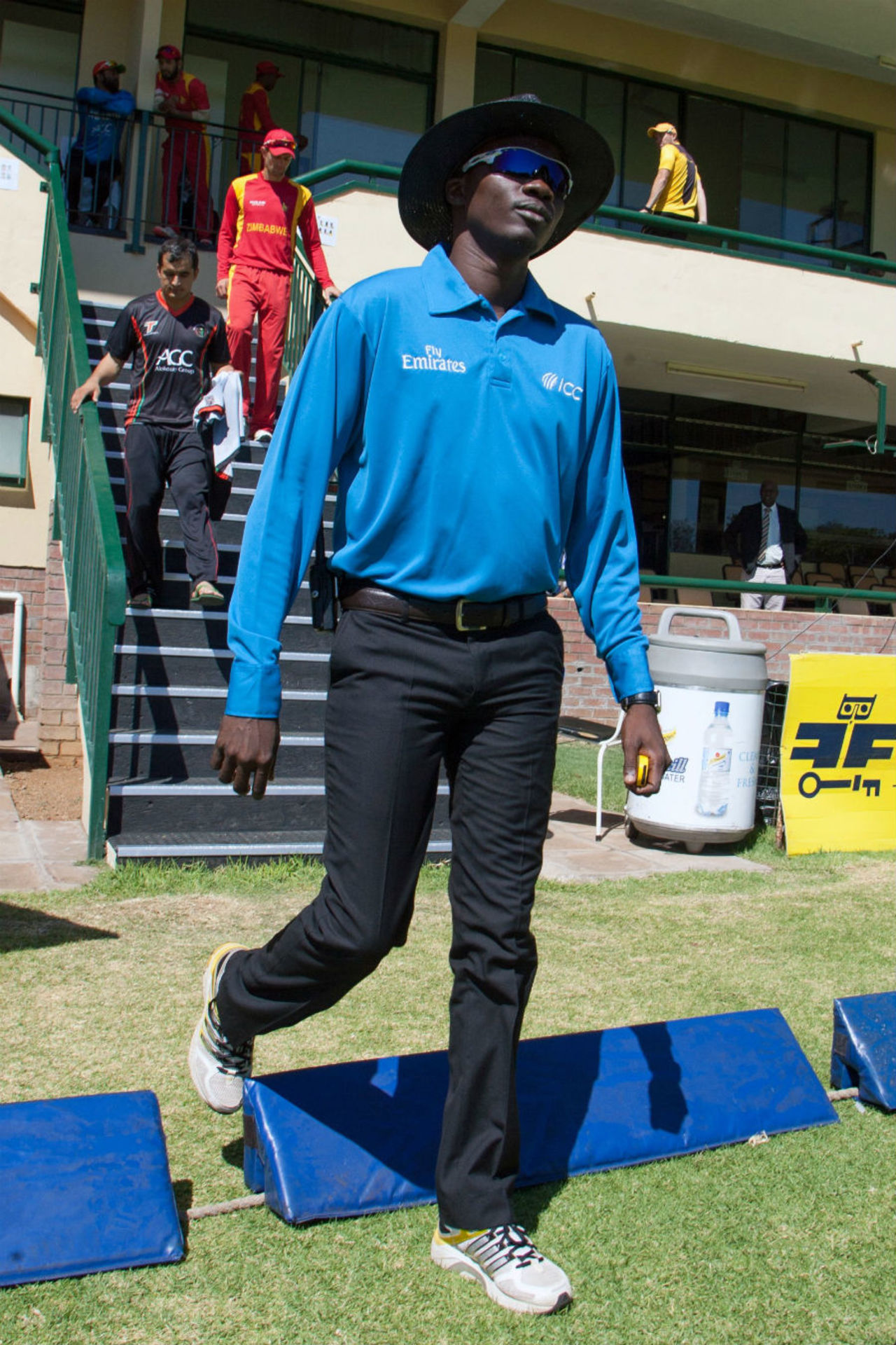 Umpire Langton Rusere walks in for his international debut, Zimbabwe v Afghanistan, 5th ODI, Bulawayo, October 24, 2015