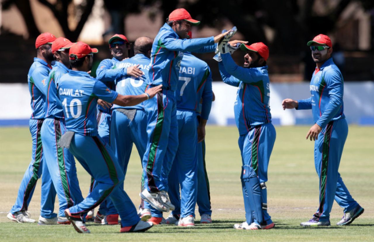 Mirwais Ashraf celebrates a wicket with his team-mates, Zimbabwe v Afghanistan, 5th ODI, Bulawayo, October 24, 2015