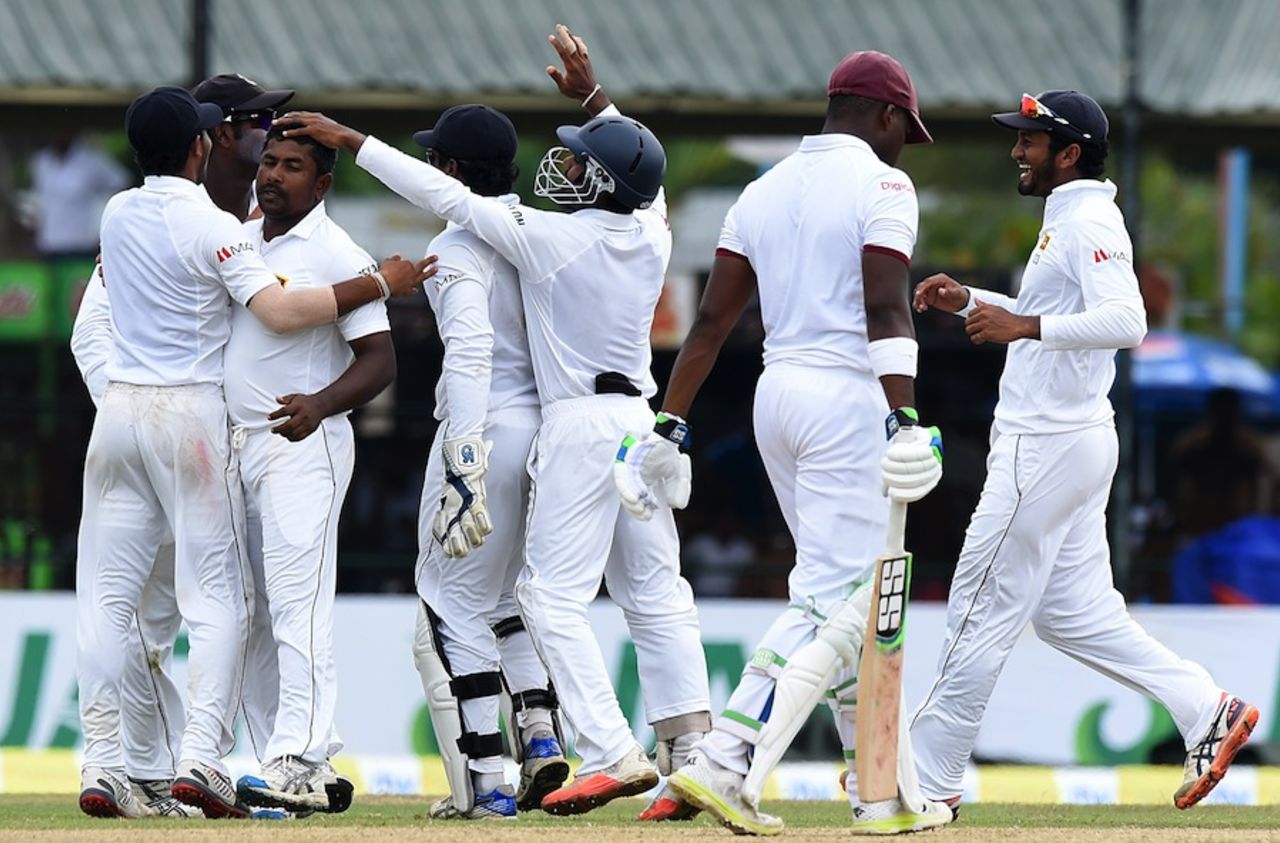 The Sri Lankans rush to celebrate with Rangana Herath, Sri Lanka v West Indies, 2nd Test, P Sara Oval, Colombo, 5th day, October 26, 2015