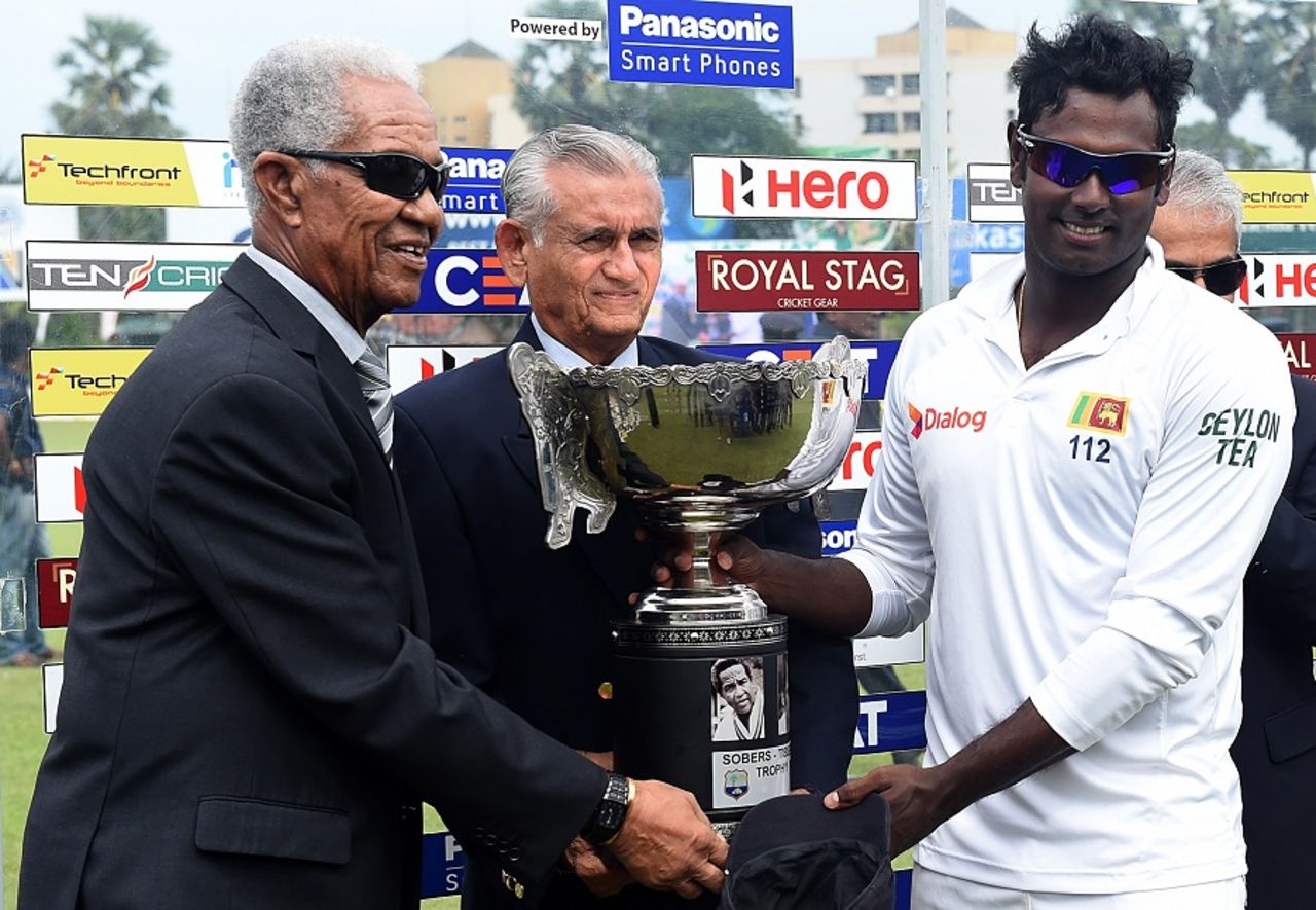 Angelo Mathews collects the trophy from Garry Sobers and Michael Tissera, Sri Lanka v West Indies, 2nd Test, P Sara Oval, Colombo, 5th day, October 26, 2015