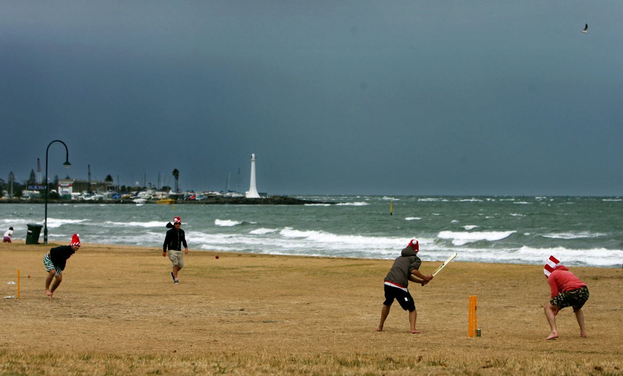 Fans hone their skills with a game of beach cricket at St Kilda beach on Christmas Day, December 25, 2006